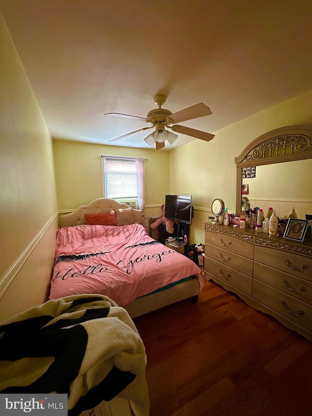 bedroom with ceiling fan and wood finished floors