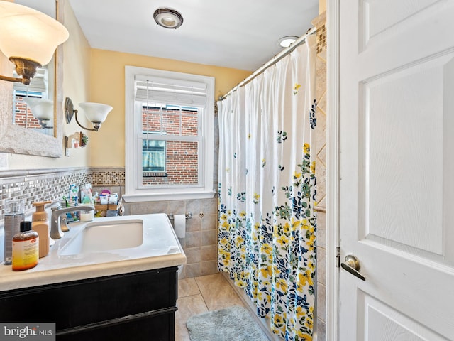 bathroom featuring tile walls, vanity, walk in shower, and tile patterned flooring