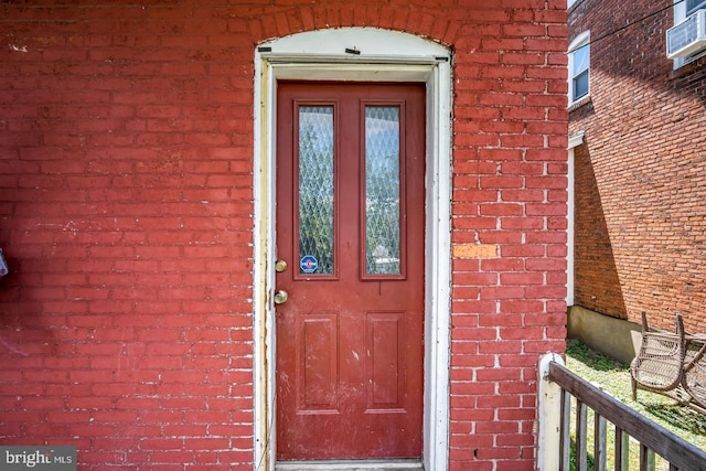 entrance to property with brick siding