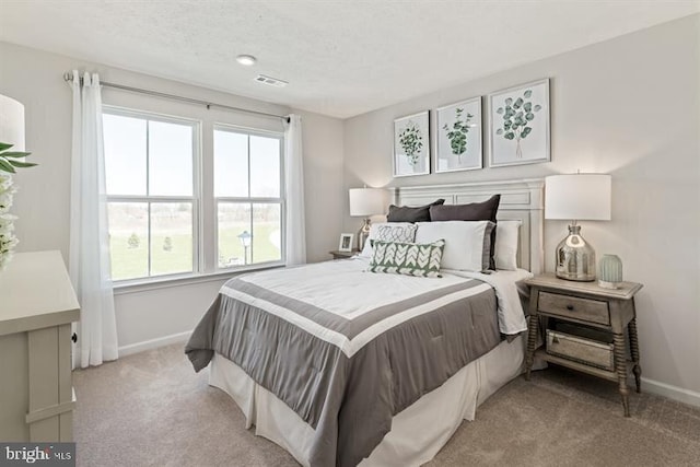 bedroom with light colored carpet