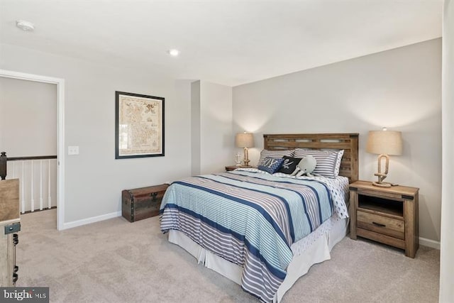 bedroom featuring light carpet