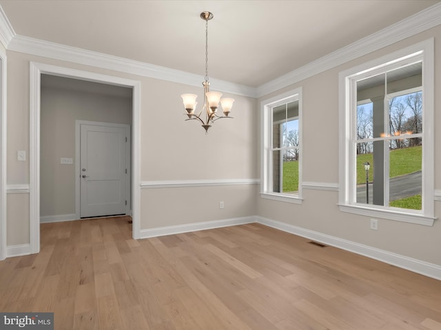 473 Orange Tree Ln, Westminster, MD 21157 - empty room with a chandelier, light wood-style flooring, baseboards, and ornamental molding