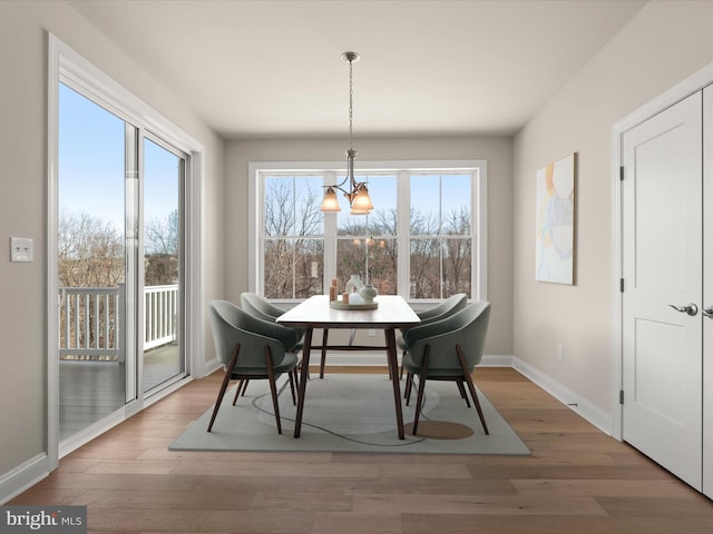 473 Orange Tree Ln, Westminster, MD 21157 - dining space with a chandelier, baseboards, and wood finished floors