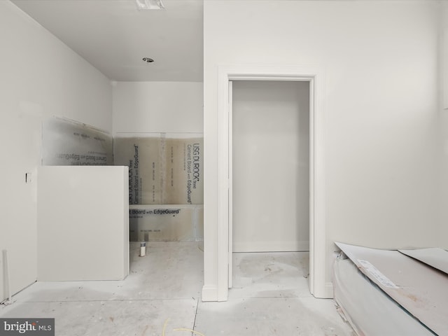 bathroom with concrete flooring