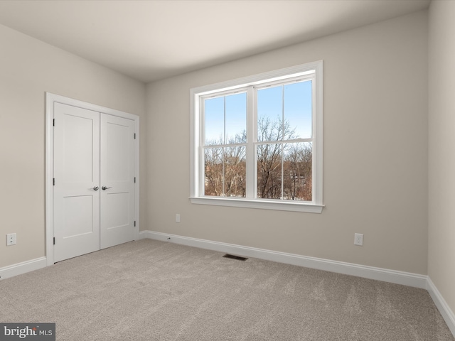 473 Orange Tree Ln, Westminster, MD 21157 - unfurnished bedroom with carpet floors, baseboards, and a closet
