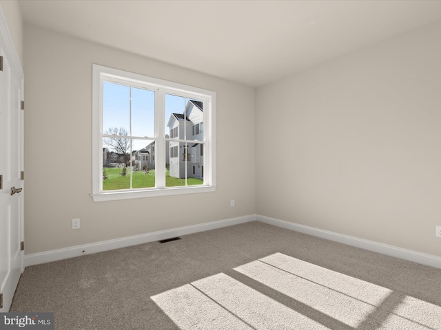 473 Orange Tree Ln, Westminster, MD 21157 - empty room with healthy amount of natural light, carpet floors, and baseboards