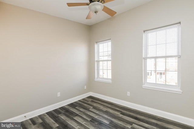 unfurnished room featuring a ceiling fan, dark wood-style flooring, and baseboards