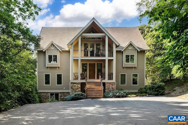 view of front of house featuring a balcony