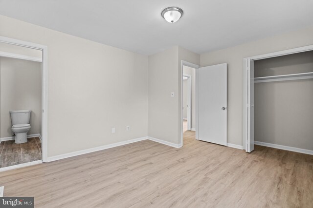 empty room with light hardwood / wood-style floors