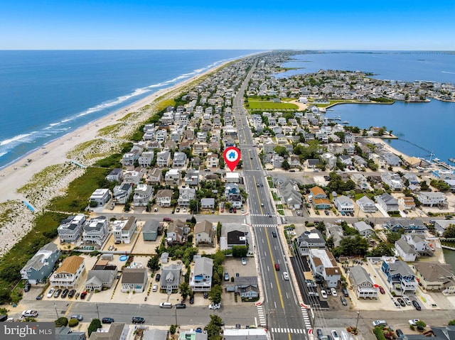 bird's eye view with a view of the beach and a water view