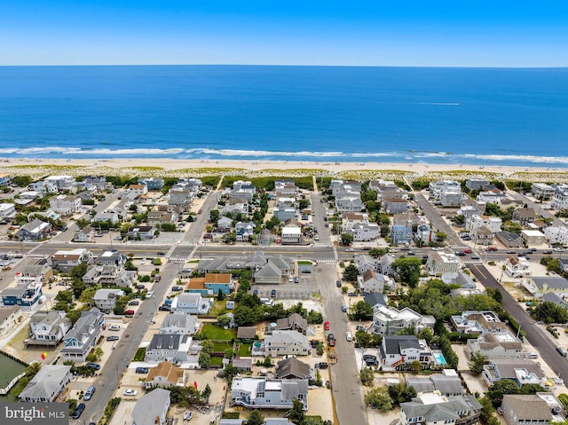 bird's eye view featuring a beach view and a water view