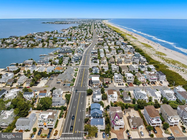 bird's eye view featuring a beach view and a water view