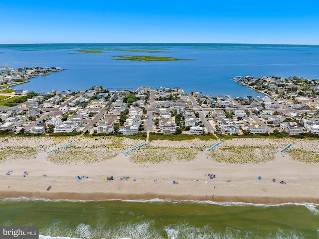 bird's eye view with a beach view and a water view