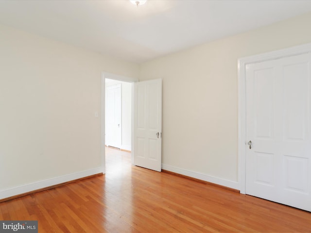 empty room with light hardwood / wood-style floors