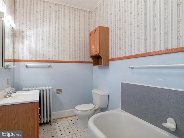 bathroom featuring vanity, a tub, crown molding, toilet, and radiator heating unit