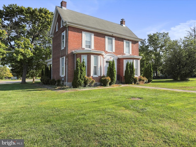 colonial home with a front yard