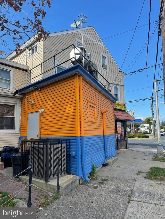 view of side of property with a balcony