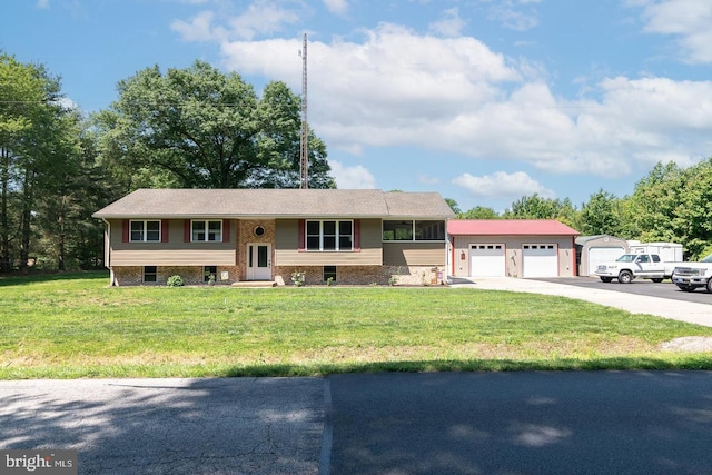 view of front of house with a garage and a front yard