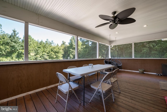 sunroom featuring ceiling fan