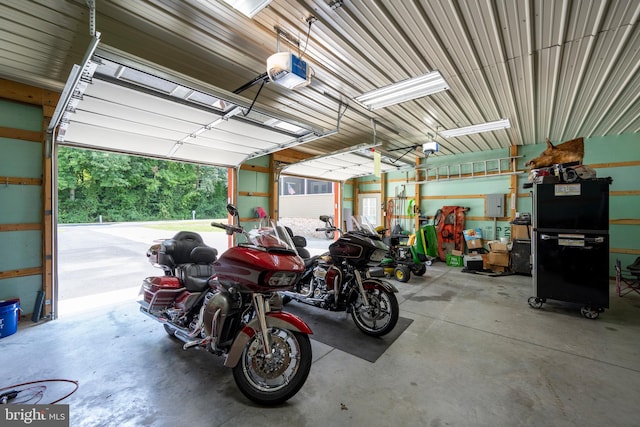 garage featuring a garage door opener and electric panel