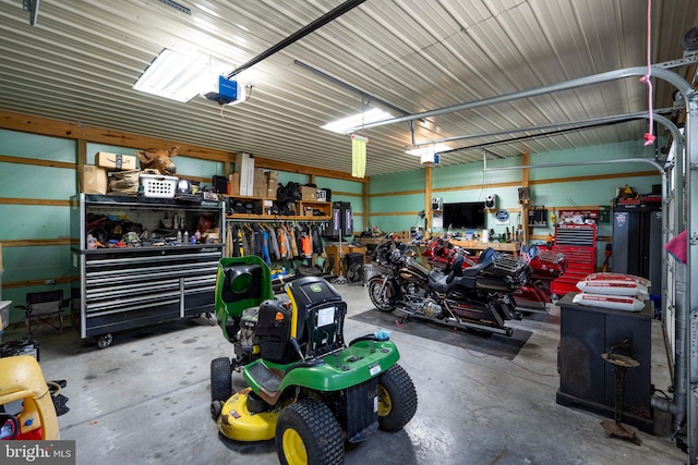 garage featuring a workshop area and a garage door opener