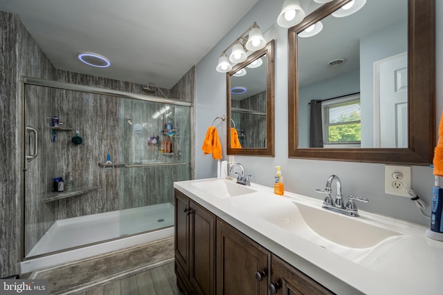 bathroom featuring an enclosed shower, hardwood / wood-style flooring, and vanity