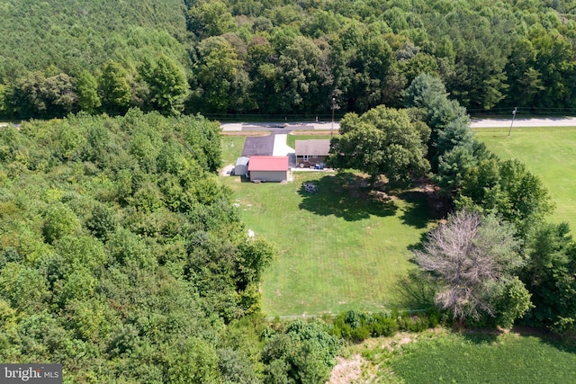 aerial view featuring a wooded view