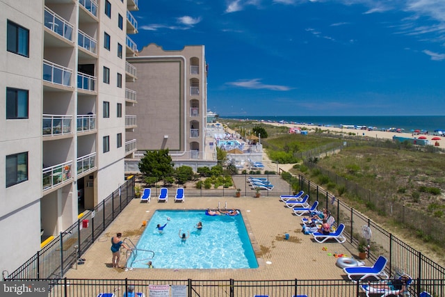 view of pool with a water view