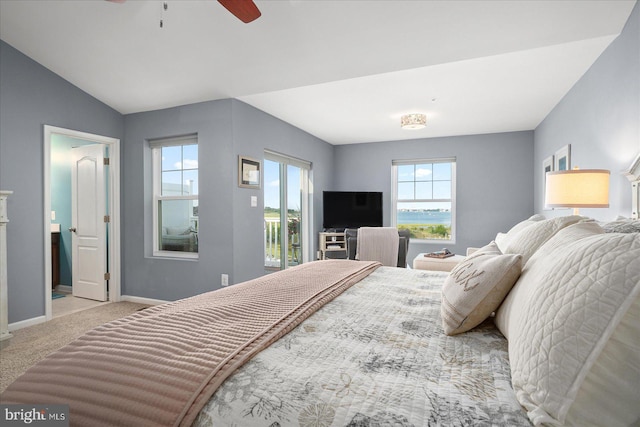 bedroom with light carpet, ceiling fan, lofted ceiling, and baseboards