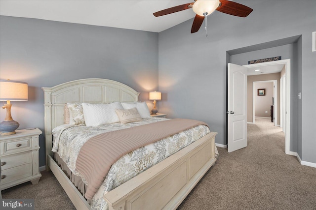 carpeted bedroom featuring a ceiling fan and baseboards