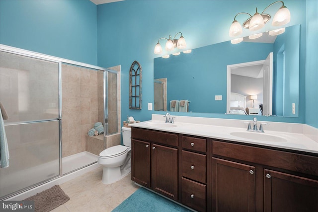 ensuite bathroom featuring a tile shower, tile patterned flooring, a sink, and connected bathroom