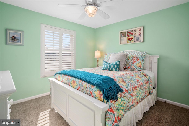 carpeted bedroom with baseboards and a ceiling fan