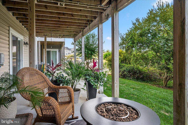 view of patio featuring an outdoor fire pit