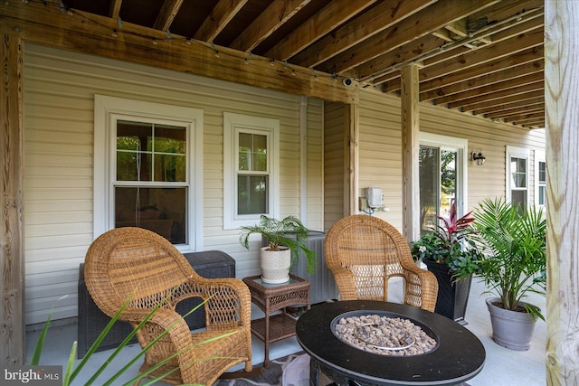 view of patio with an outdoor fire pit