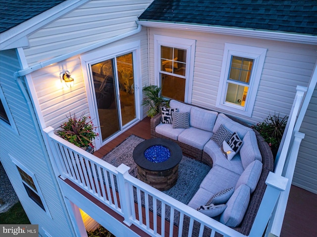 view of patio featuring an outdoor living space with a fire pit