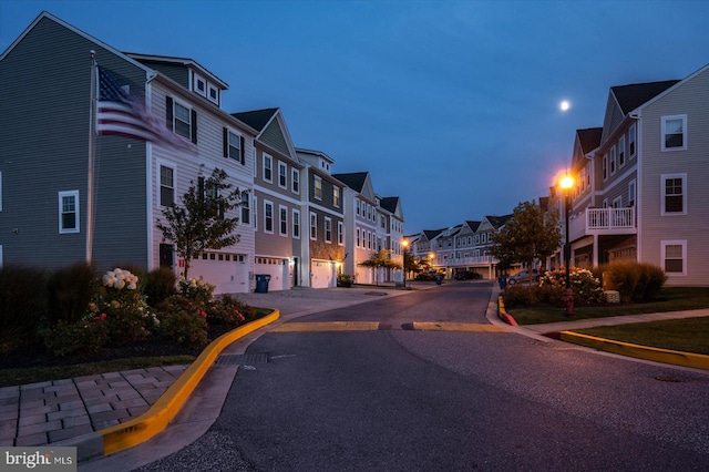 view of street featuring a residential view and curbs