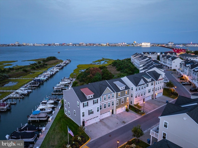 birds eye view of property featuring a water view