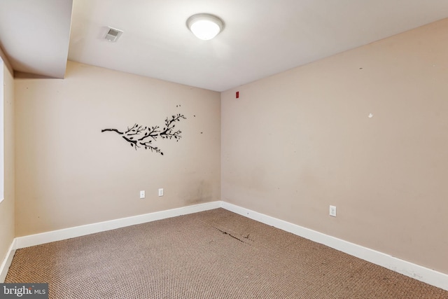 unfurnished room with carpet flooring