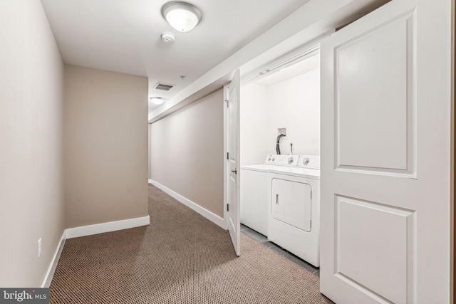 washroom featuring independent washer and dryer and carpet floors