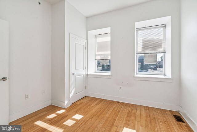 unfurnished room featuring light hardwood / wood-style floors