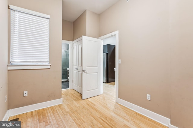 unfurnished room featuring light wood-type flooring