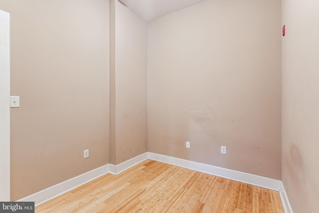 spare room with light hardwood / wood-style flooring