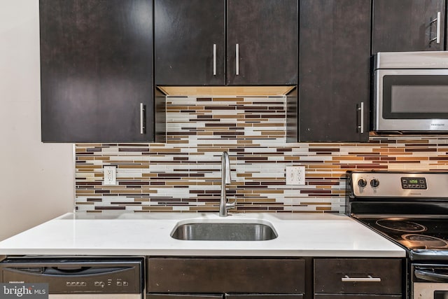 kitchen with sink, decorative backsplash, dark brown cabinets, and stainless steel appliances