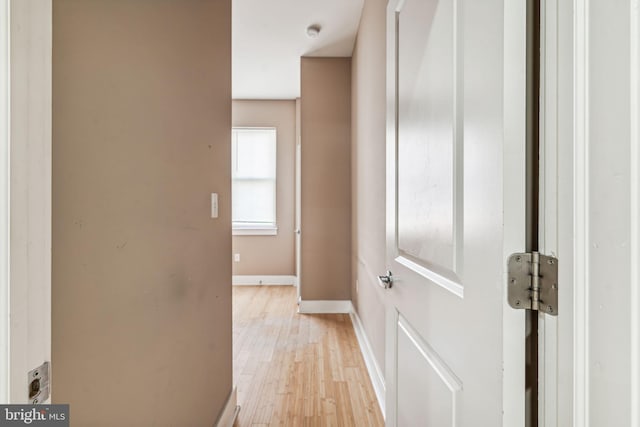 corridor with light wood-type flooring