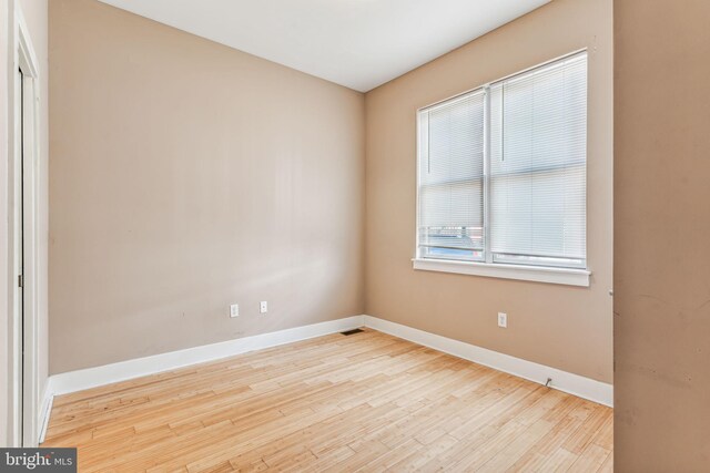 unfurnished room featuring light hardwood / wood-style floors