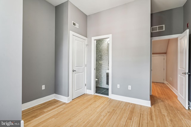 unfurnished bedroom with light wood-type flooring