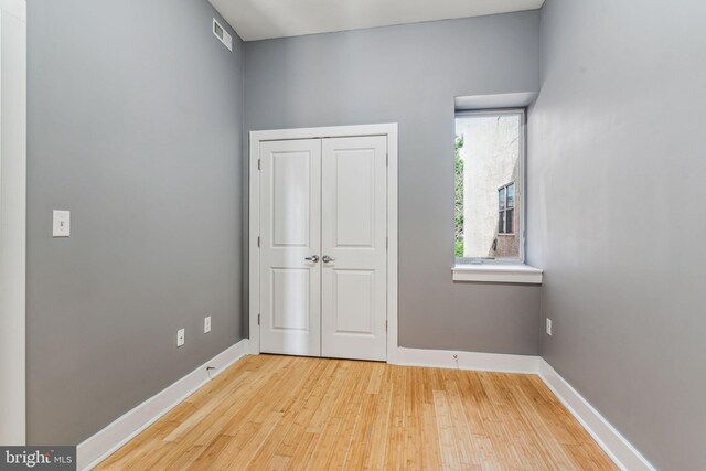 unfurnished room featuring light hardwood / wood-style floors