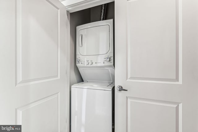 laundry room with stacked washer and clothes dryer