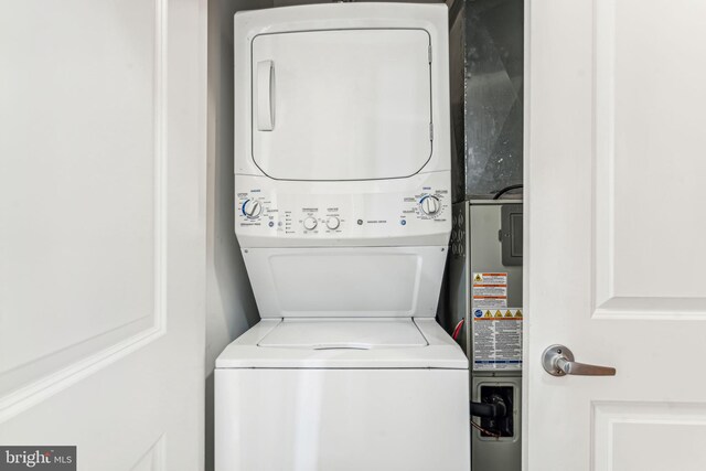 washroom with stacked washer and dryer