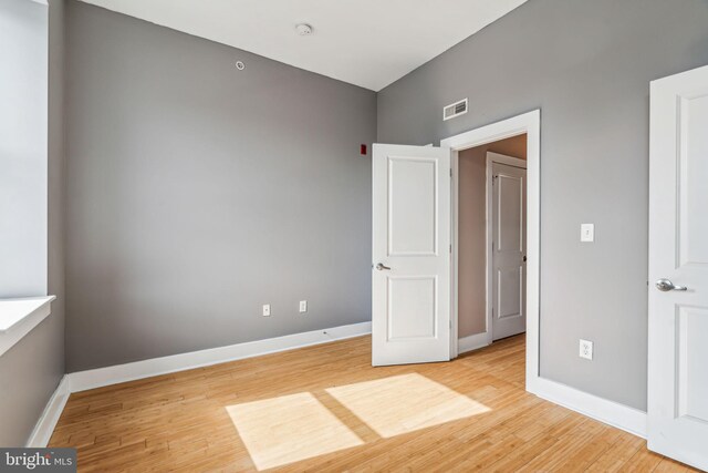 unfurnished room with light hardwood / wood-style floors